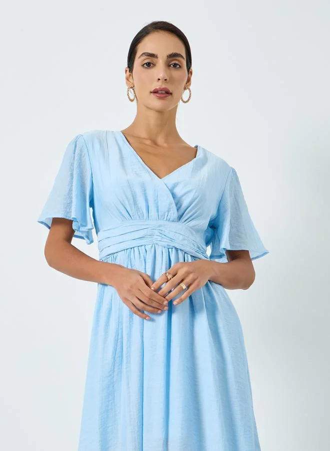 مكسيم كريشن تنورة ميدي قصيرة الأكمام بلون أزرق سماوي للنساء